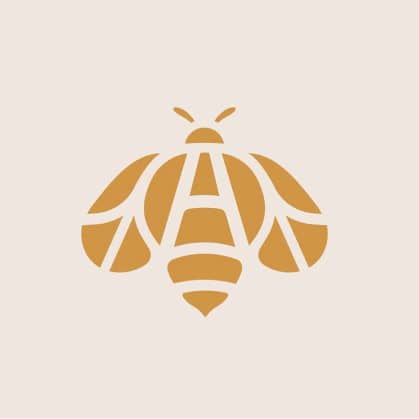 Geometric golden bee logo with letter A integrated into wings and body on beige background for Apiary project